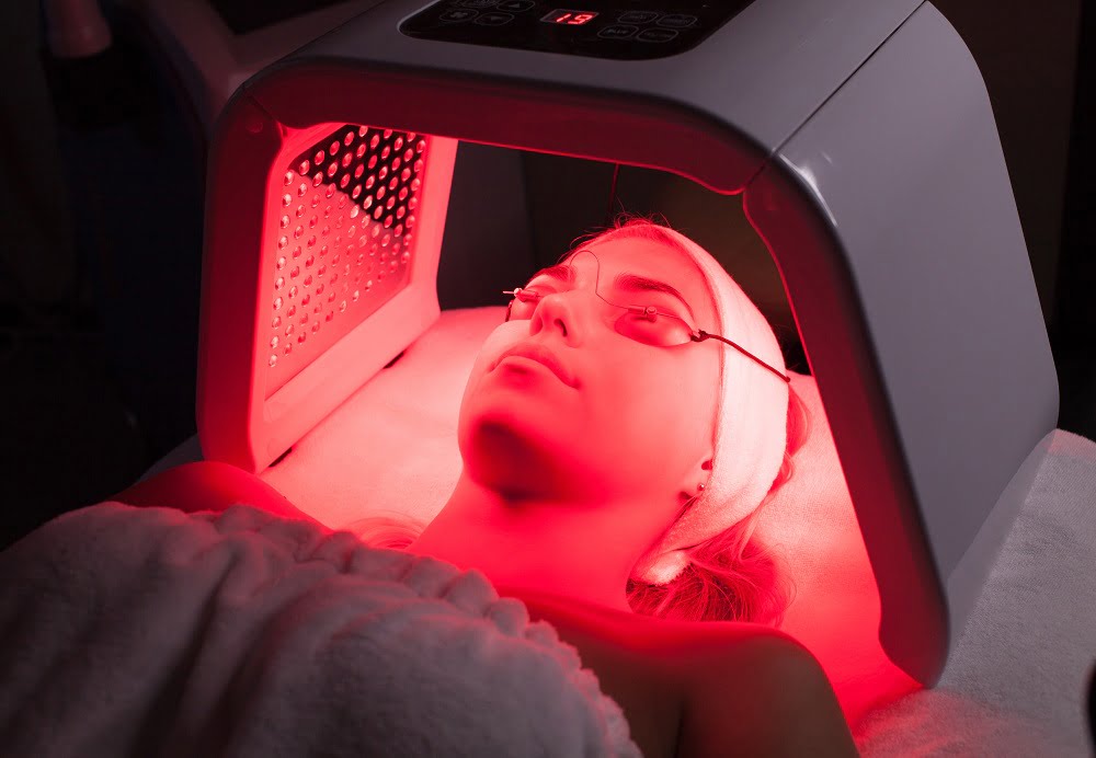 A Girl taking LED Light Therapy | Cultivated Beauty Aesthetic in Guntersville, AL