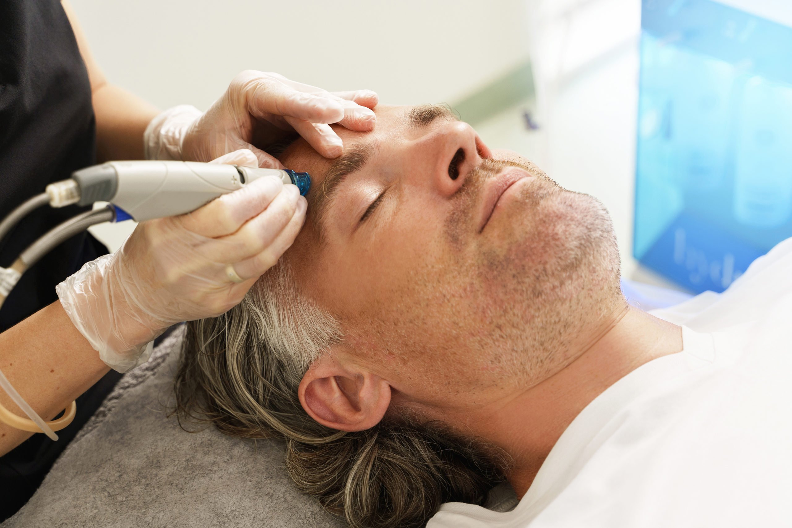 A Man getting facial treatment | Cultivated Beauty Aesthetic | Medspa in Guntersville, AL